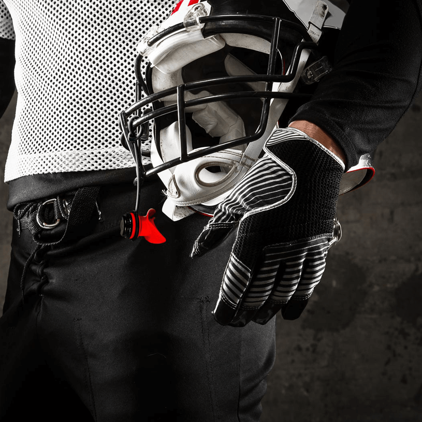 AEROSx LUNG TRAINER HELD BY FOOTBALL PLAYER STRAPPED TO HELMET