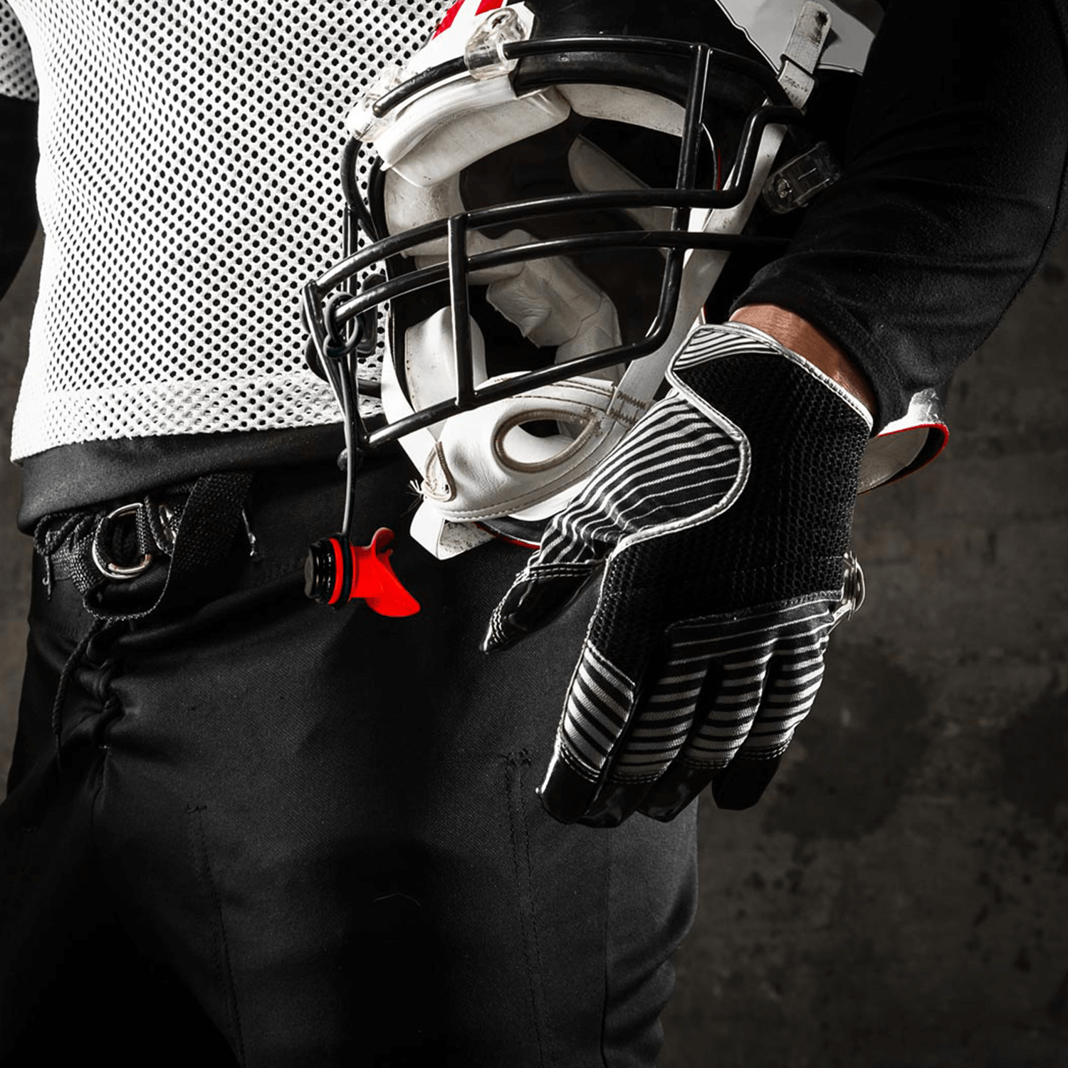 AEROSx LUNG TRAINER HELD BY FOOTBALL PLAYER STRAPPED TO HELMET