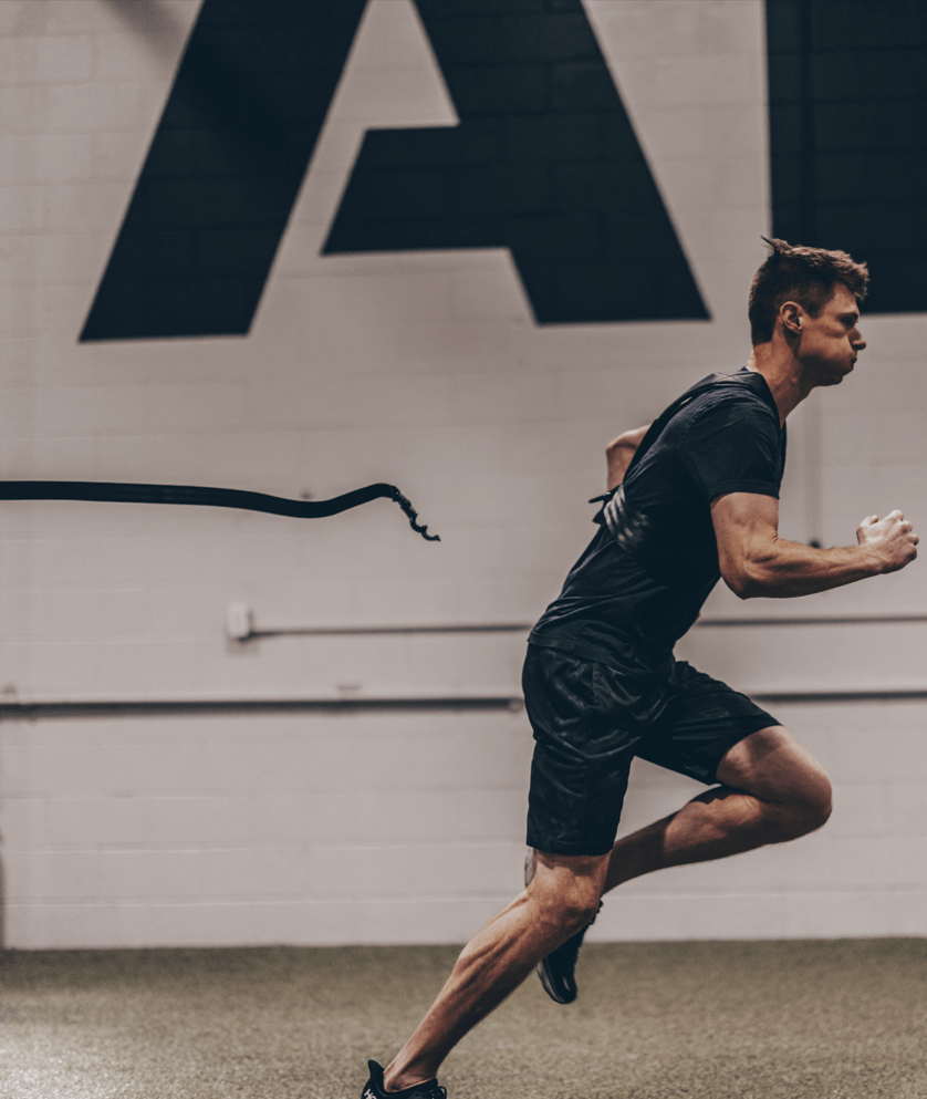 EpicBody Launch Belt with Release Strap- view of man running using release