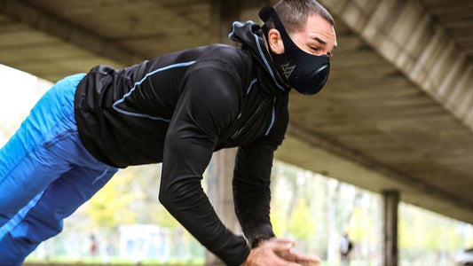 a guy doing intense push ups under the bridge wearing a training mask 3.0