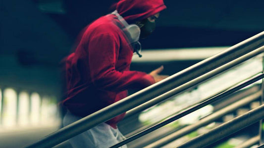 guy in red sweater doing exercise on stairs wearing trainingmask 3.0